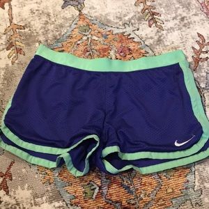 NIKE DRI FIT PURPLE AND GREEN SHORTS M